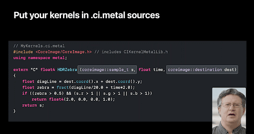 lines of code on screen with snapshot of a man's face in the bottom right corner