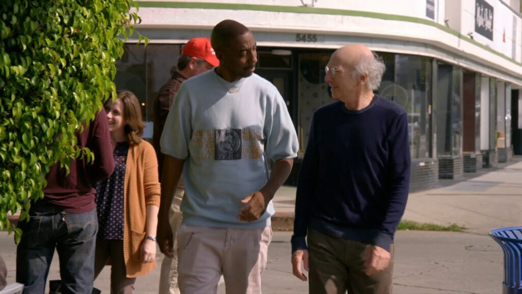 Two men walking and talking.