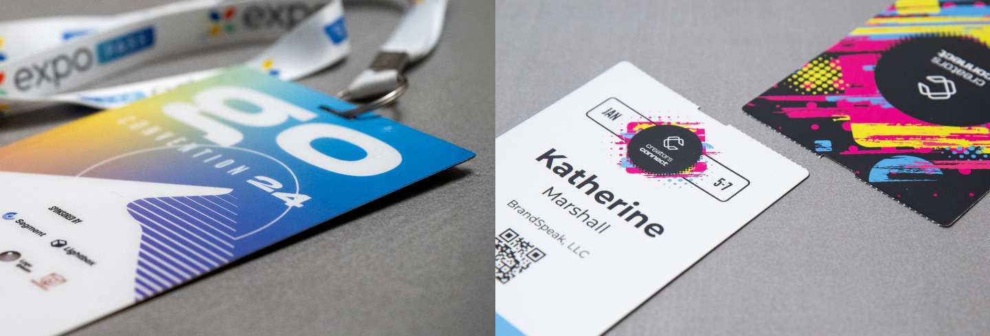 Plastic event badge next to paper event badges